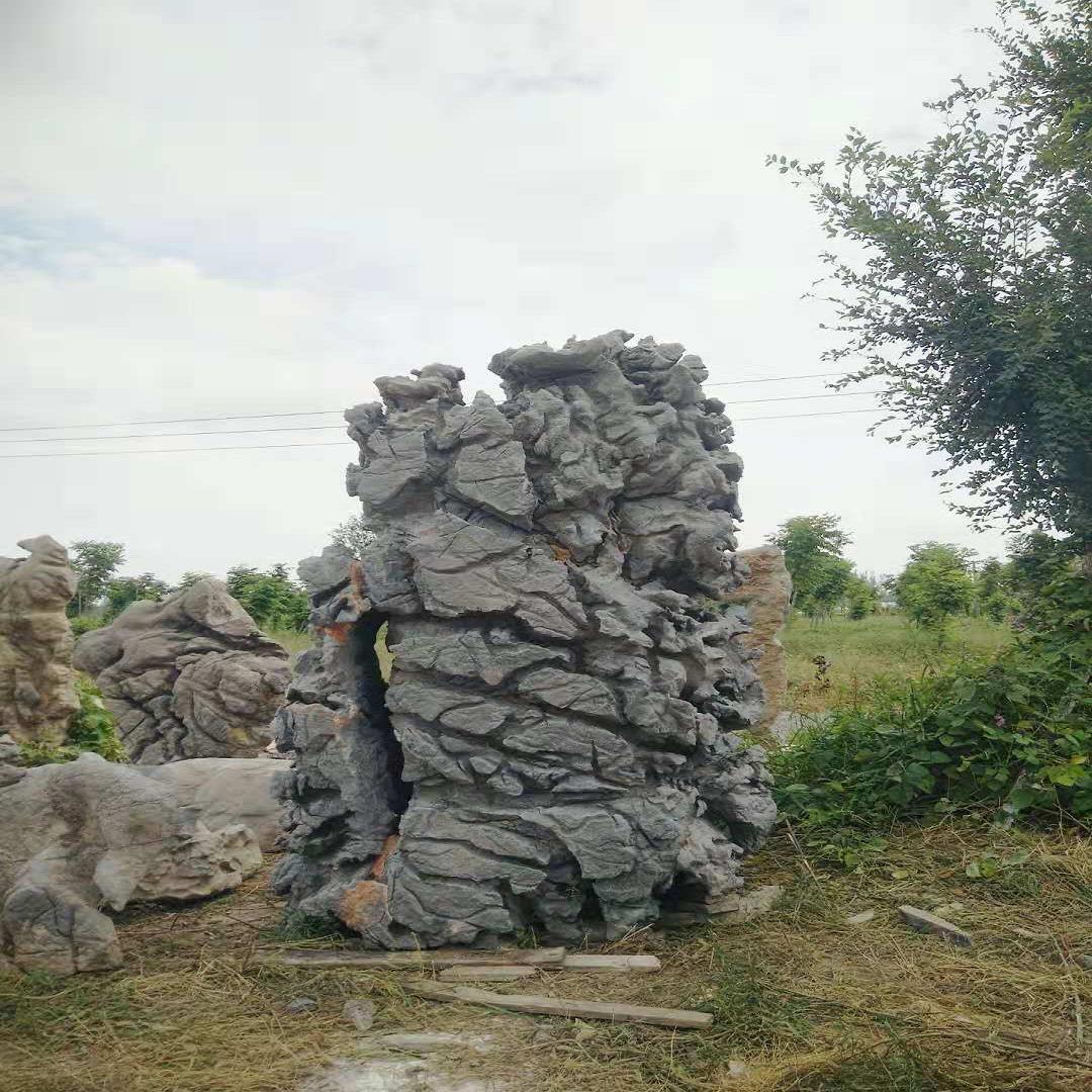 黑白千层石、黄色千层石假山价格、驳岸石一吨的价格、千层石假山制作、满意石业